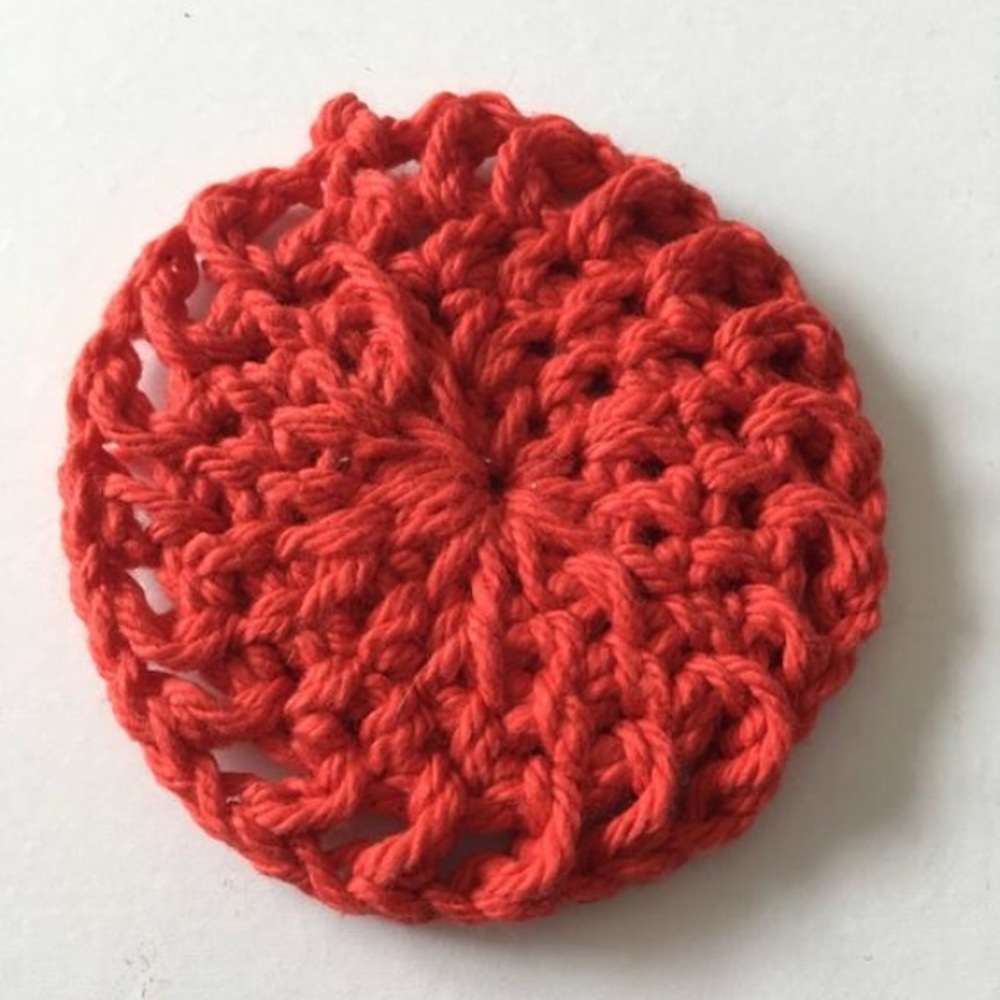 Red cotton round, makeup remover tool